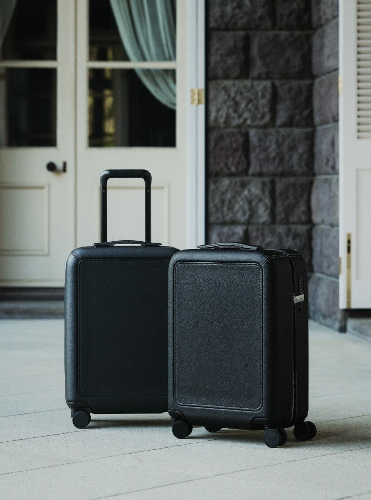 Two Grain suitcases side by side